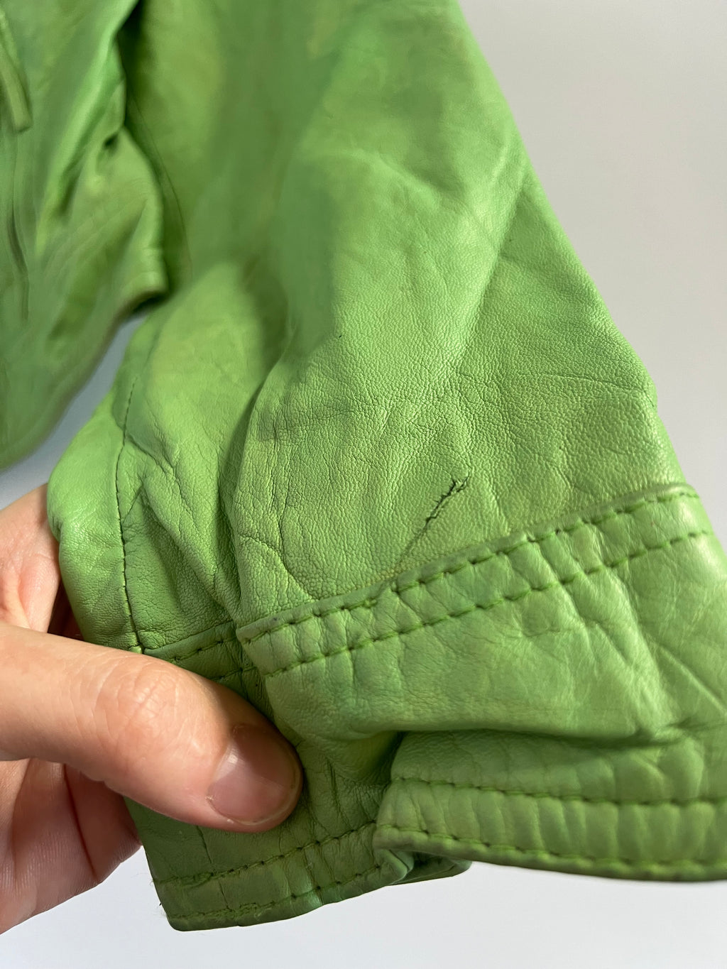Tight fit green leather zip up moto jacket