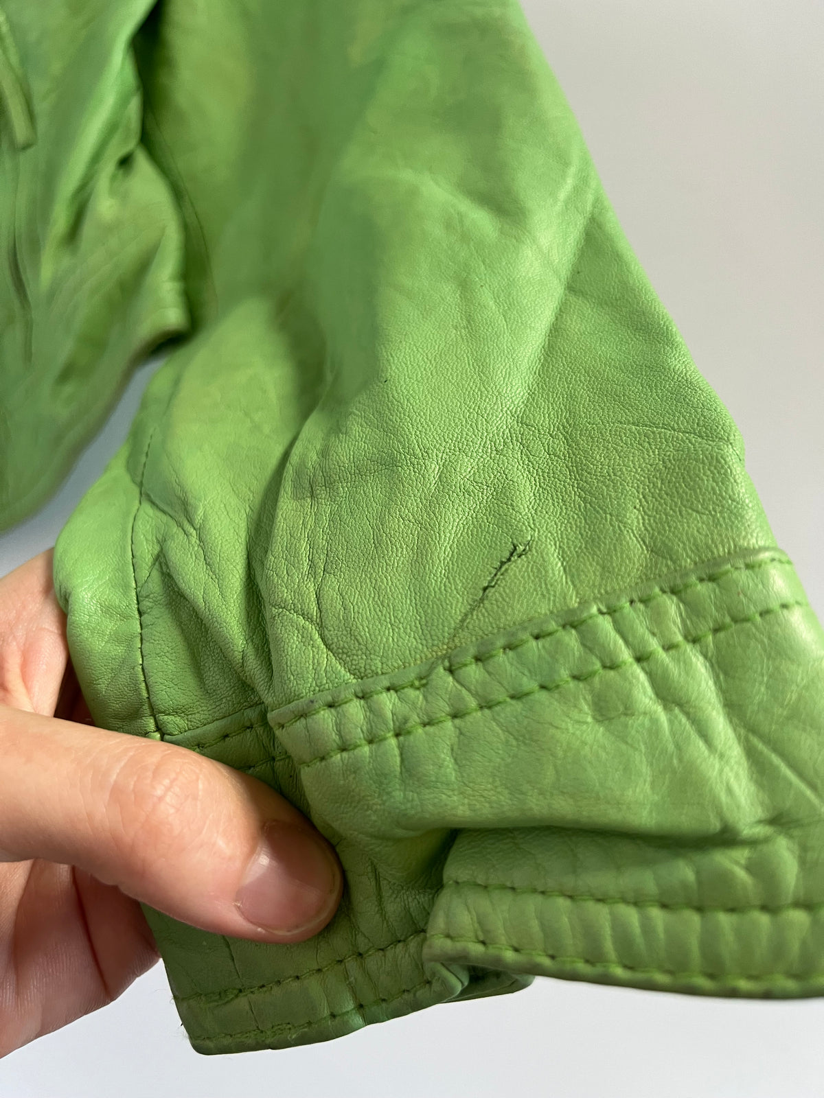 Tight fit green leather zip up moto jacket