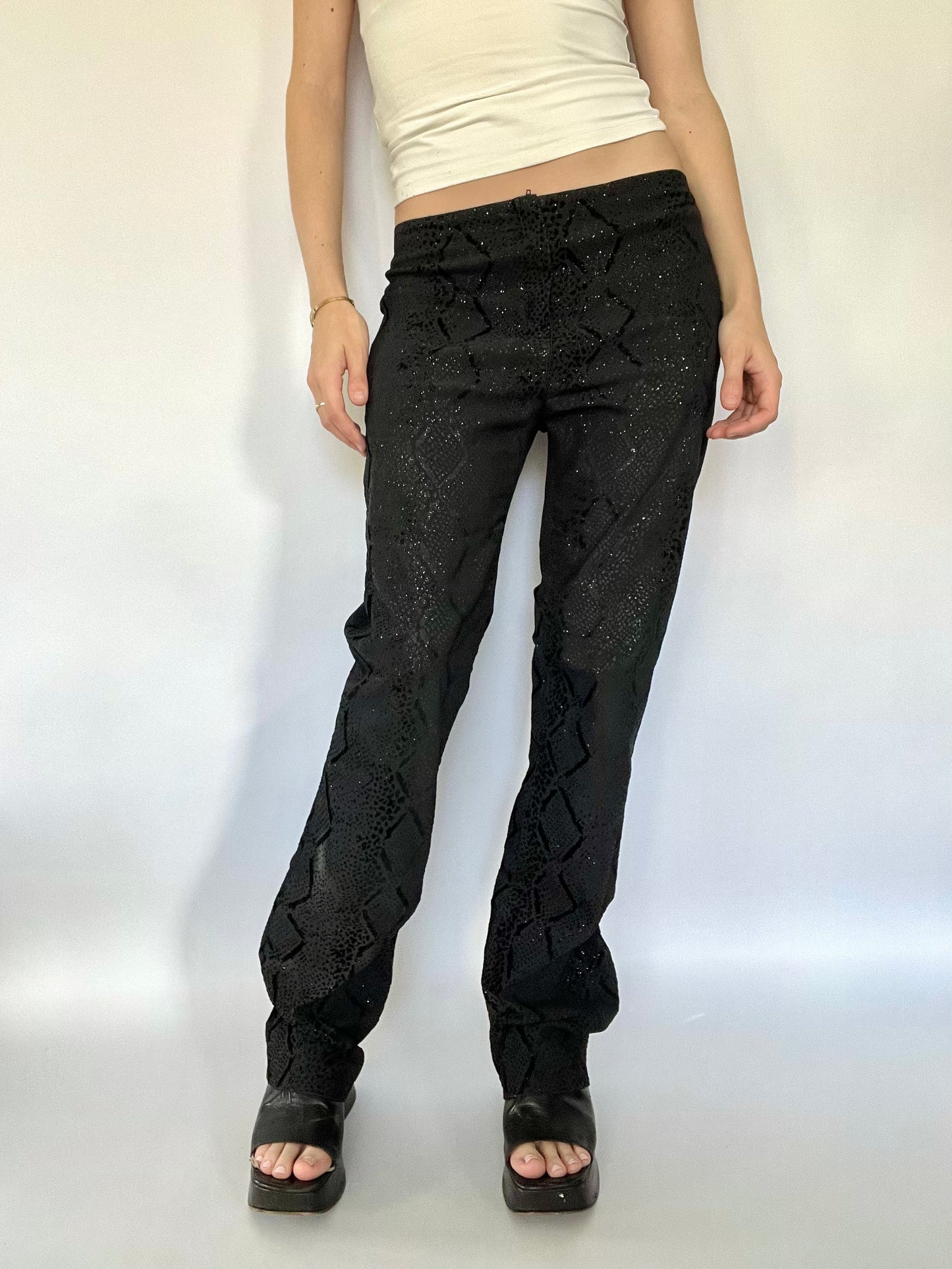 Black glittery snakeskin trousers
