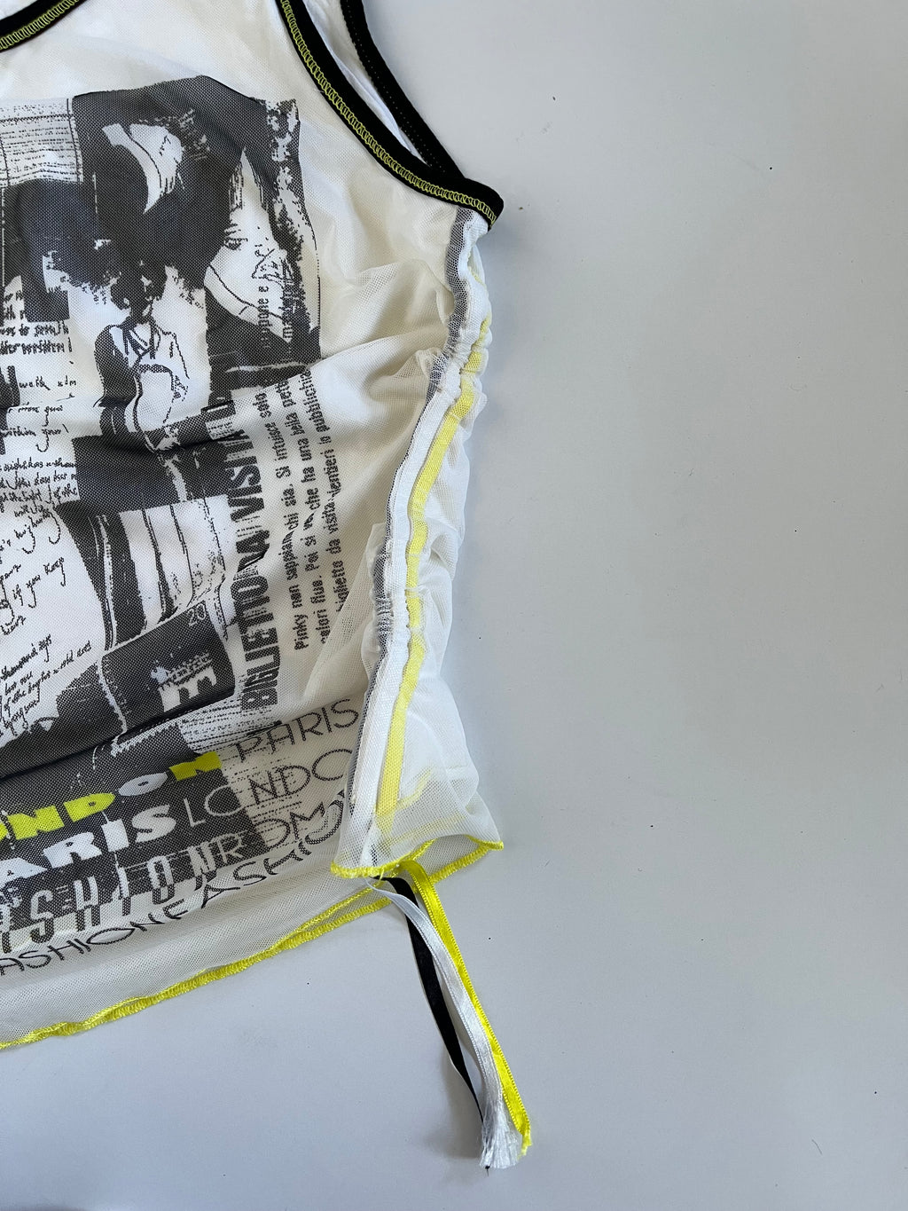 Subversive graphic mesh overlay tank top