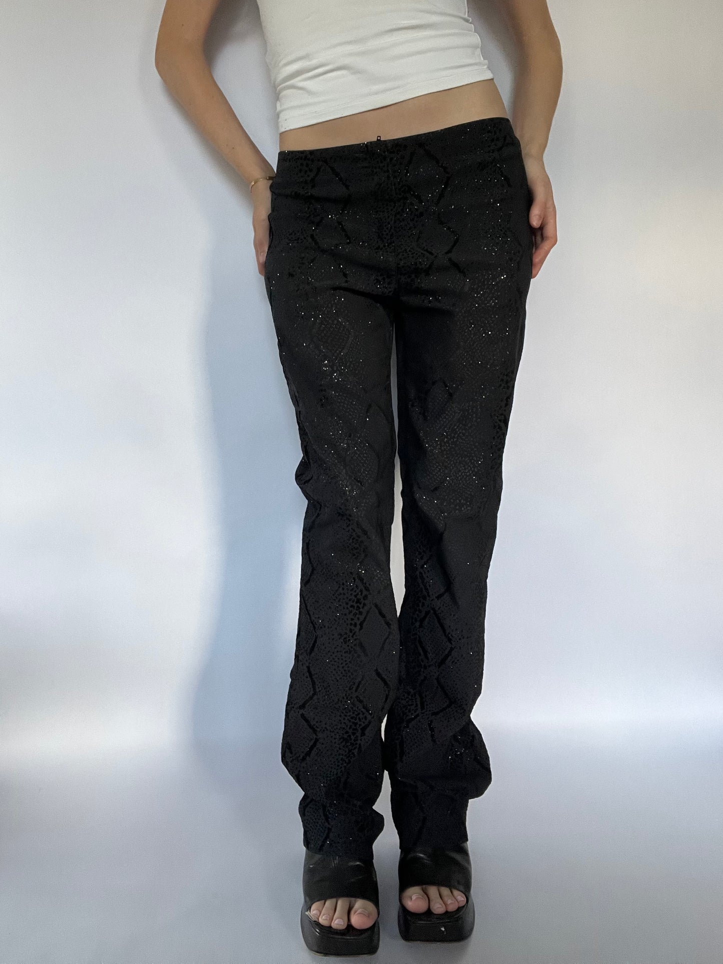 Black glittery snakeskin trousers