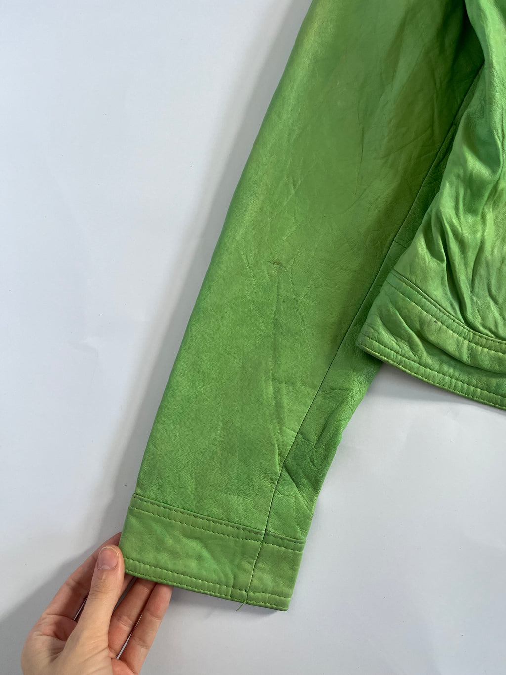 Tight fit green leather zip up moto jacket