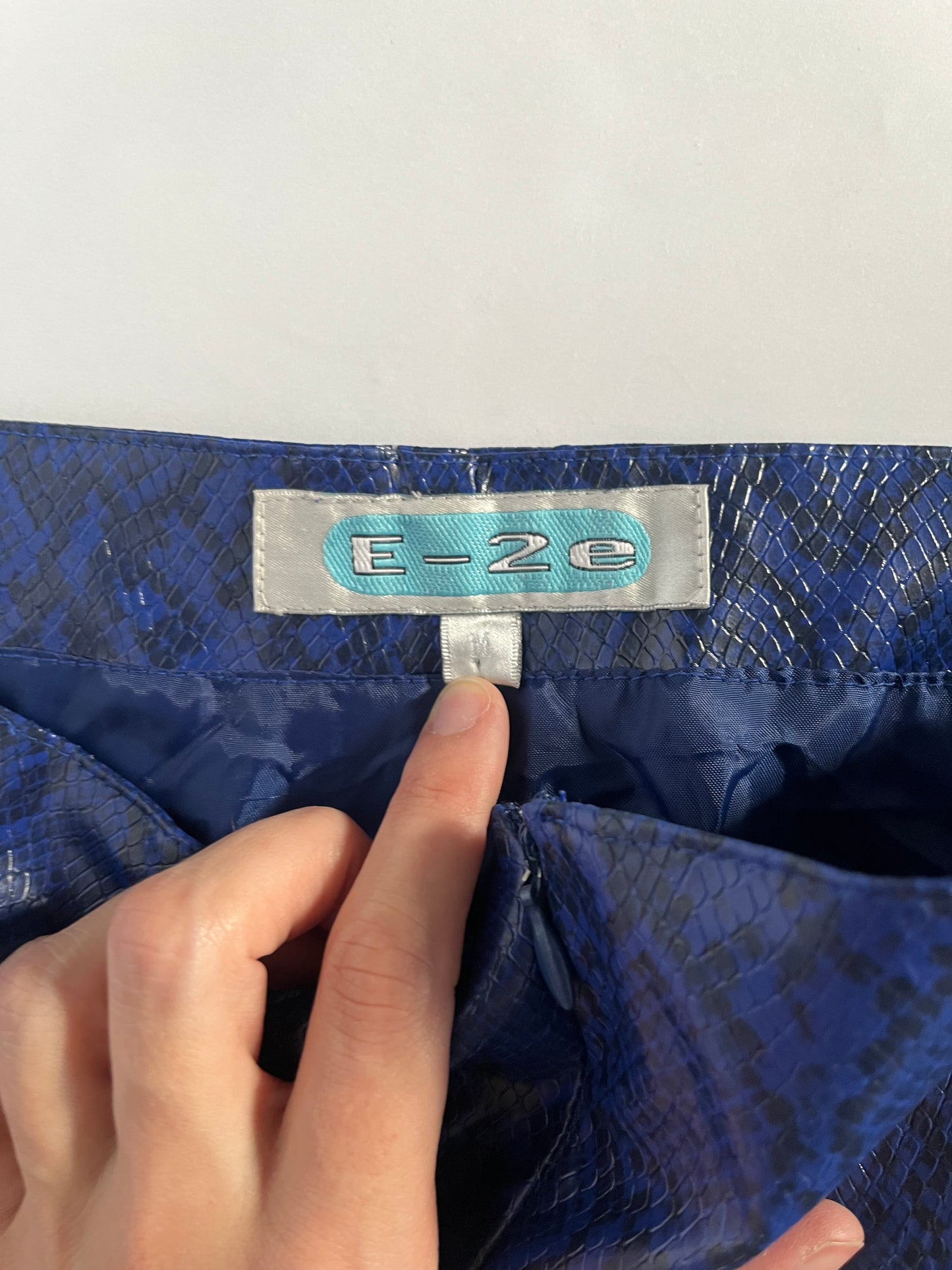 Blue patent snakeskin trousers
