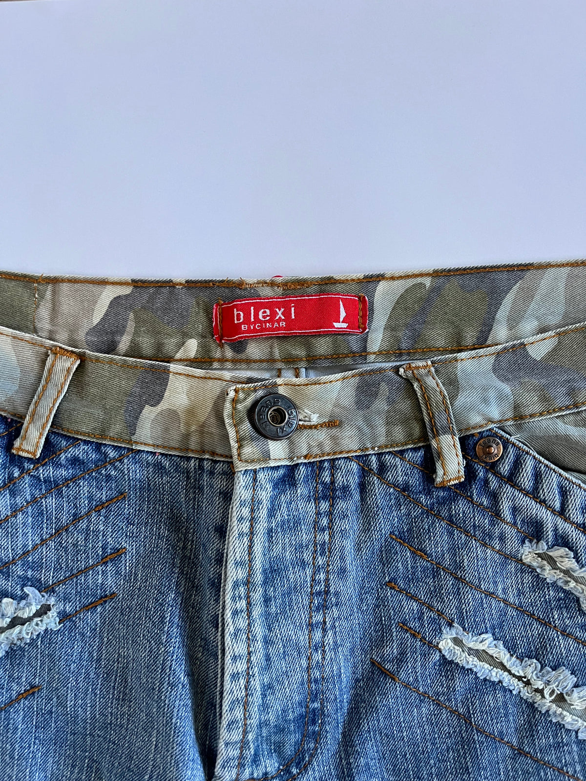 Camo distressed straight leg jeans