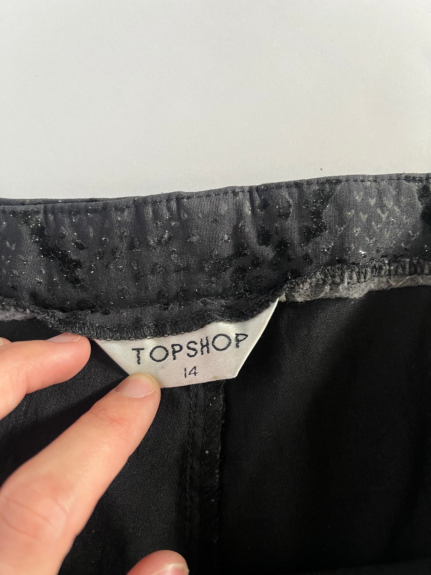Black glittery snakeskin trousers