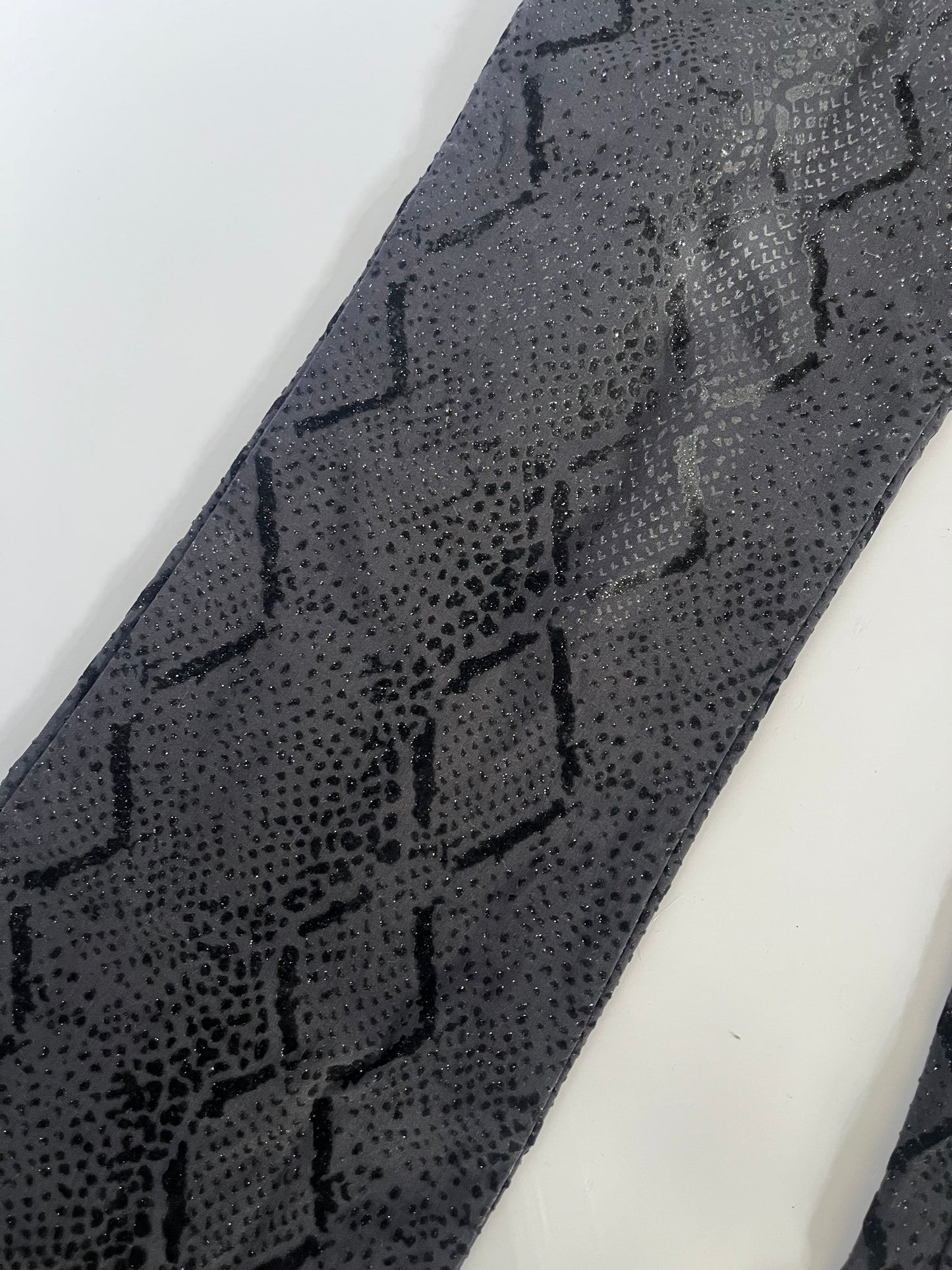 Black glittery snakeskin trousers